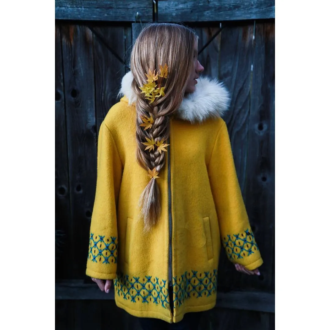 Long braided ponytail with decorative autumn leaves