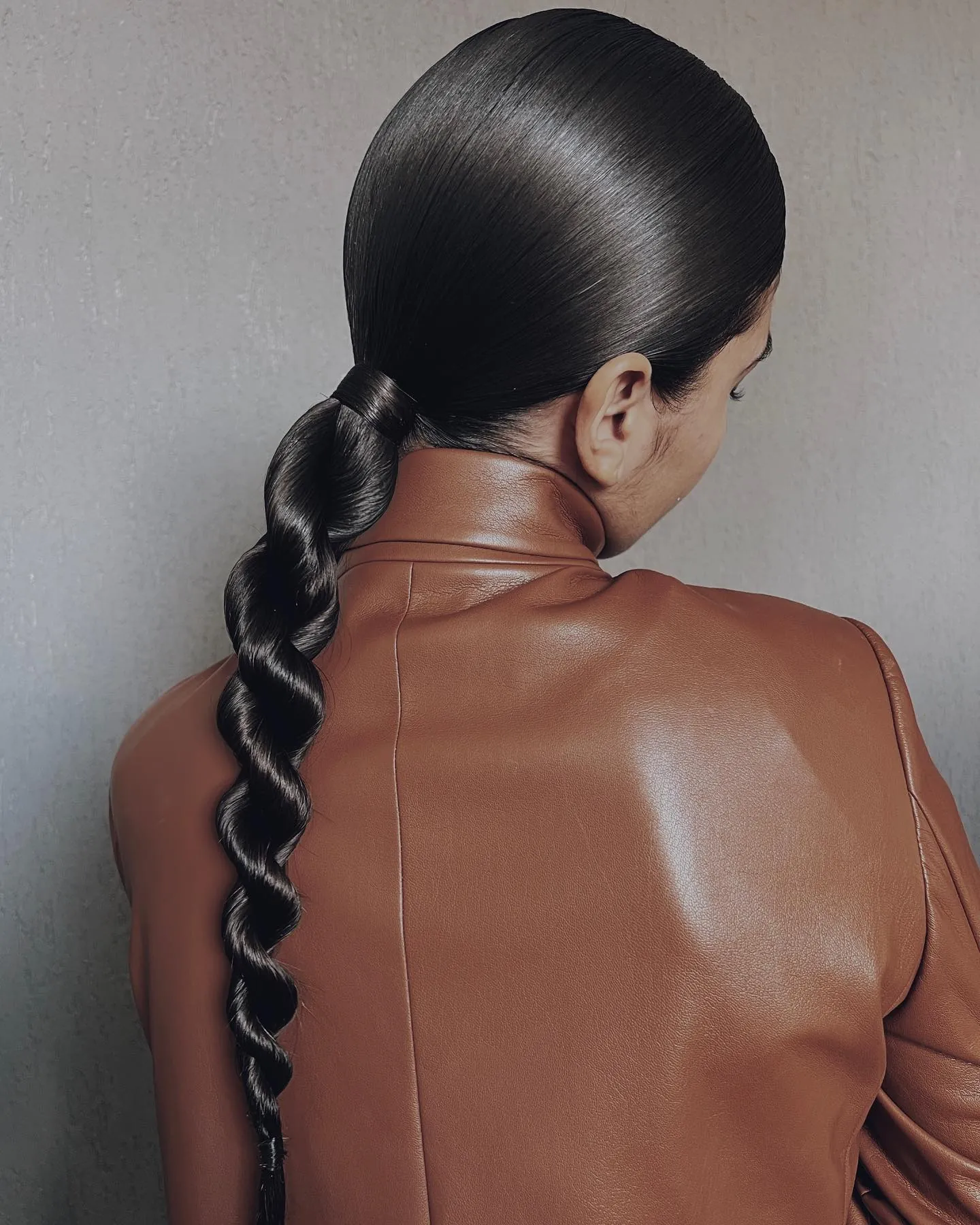 Sleek black twisted bubble ponytail
