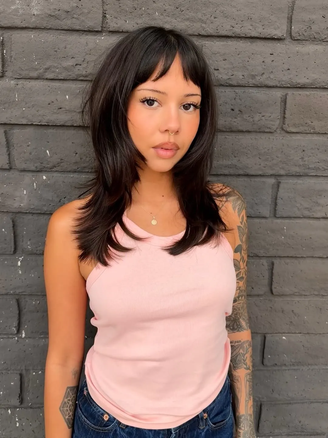Long layered haircut with piecey baby bangs