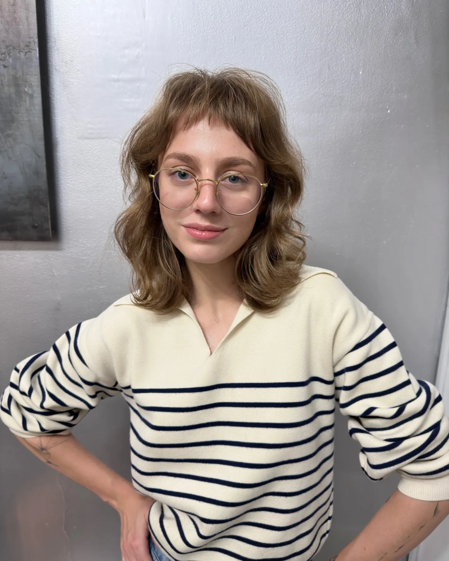 Wavy shag haircut with curved baby bangs