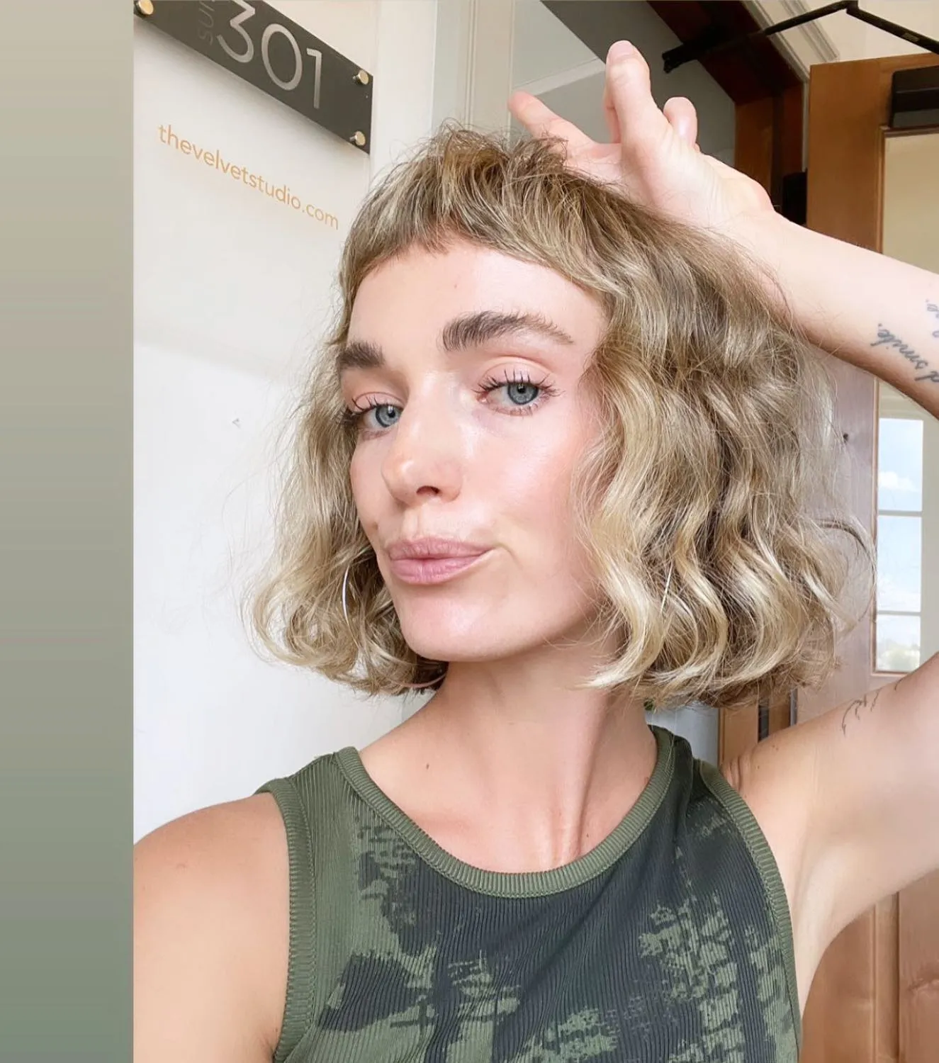 Curly bob with wispy baby bangs