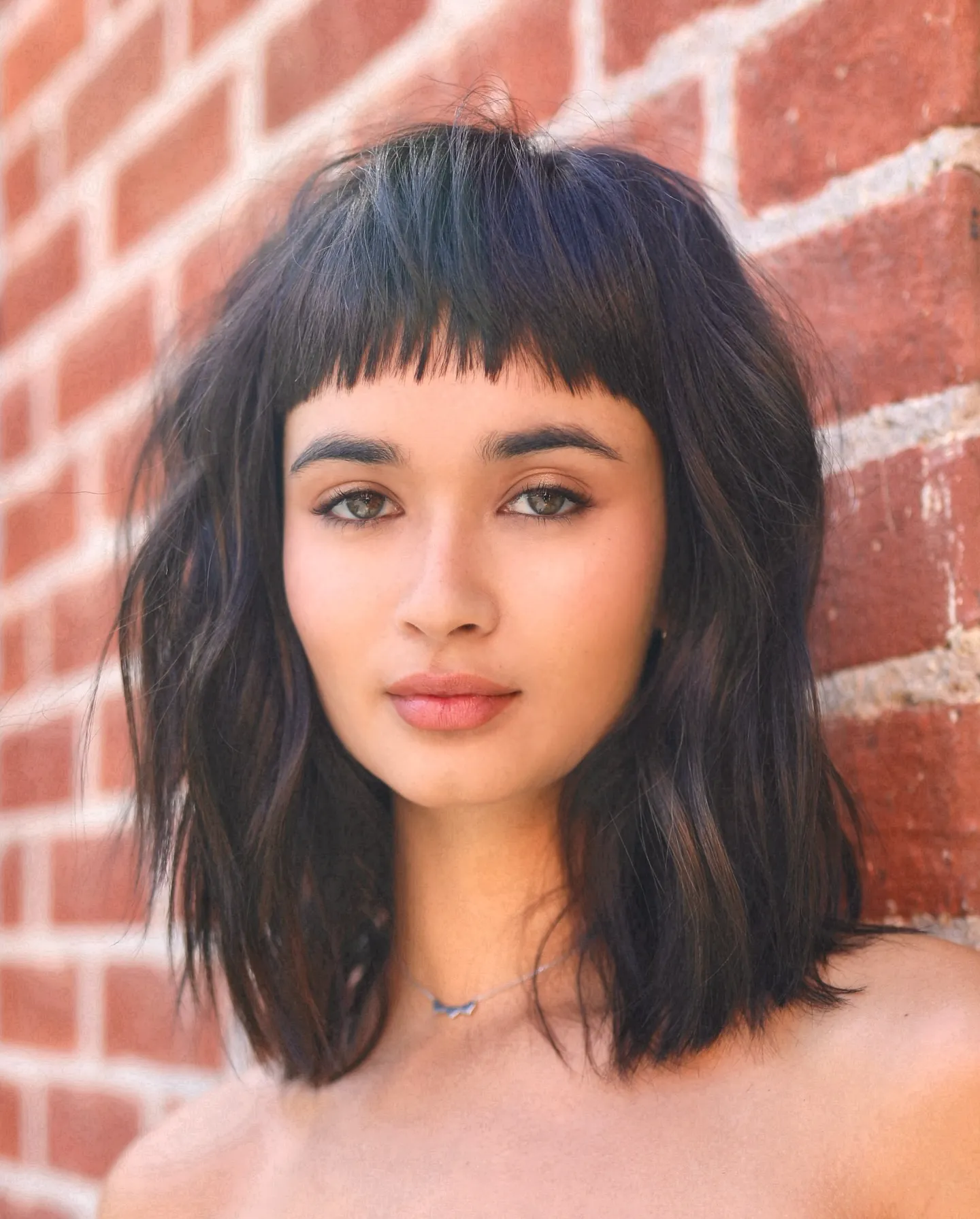 Wavy lob with thick baby bangs