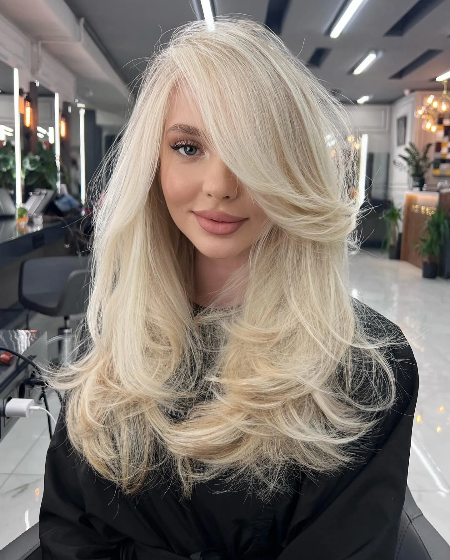 Long baby blonde layers with sweeping fringe