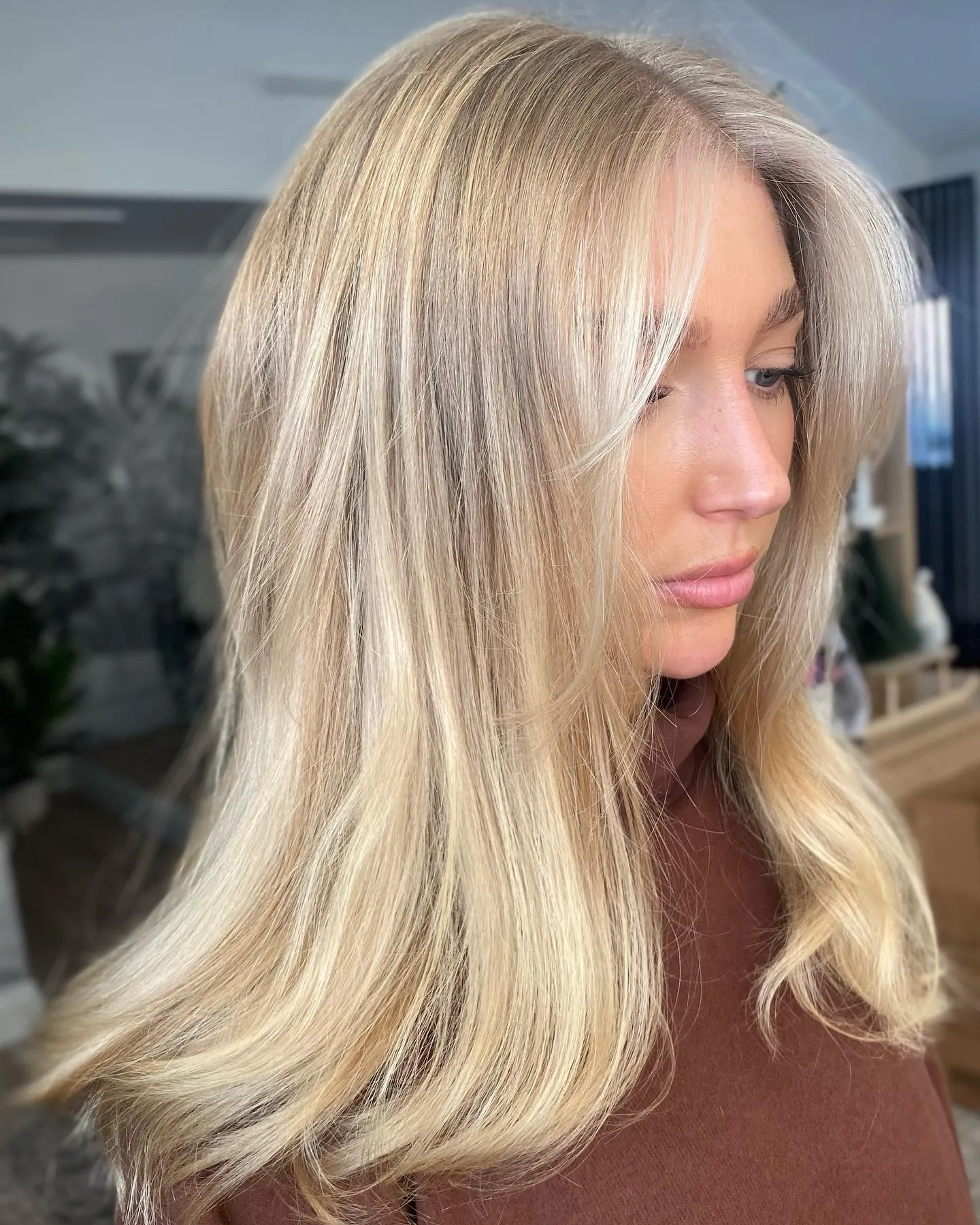 Long baby blonde layers with soft bend