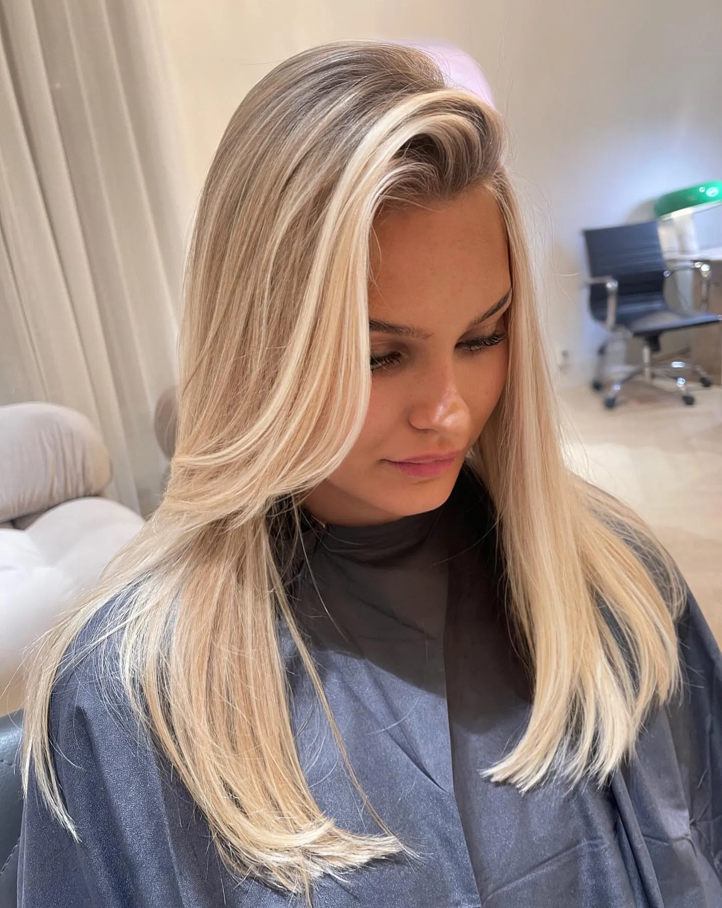 Smooth baby blonde hair with long face-framing layers