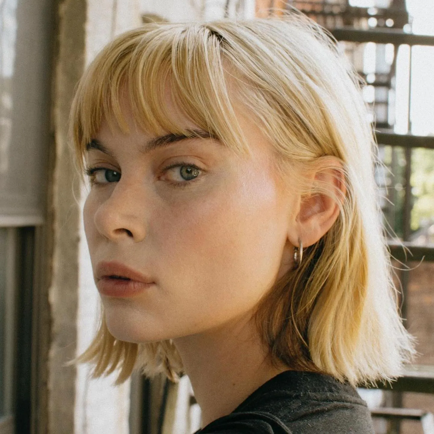 Baby blonde shag with full fringe
