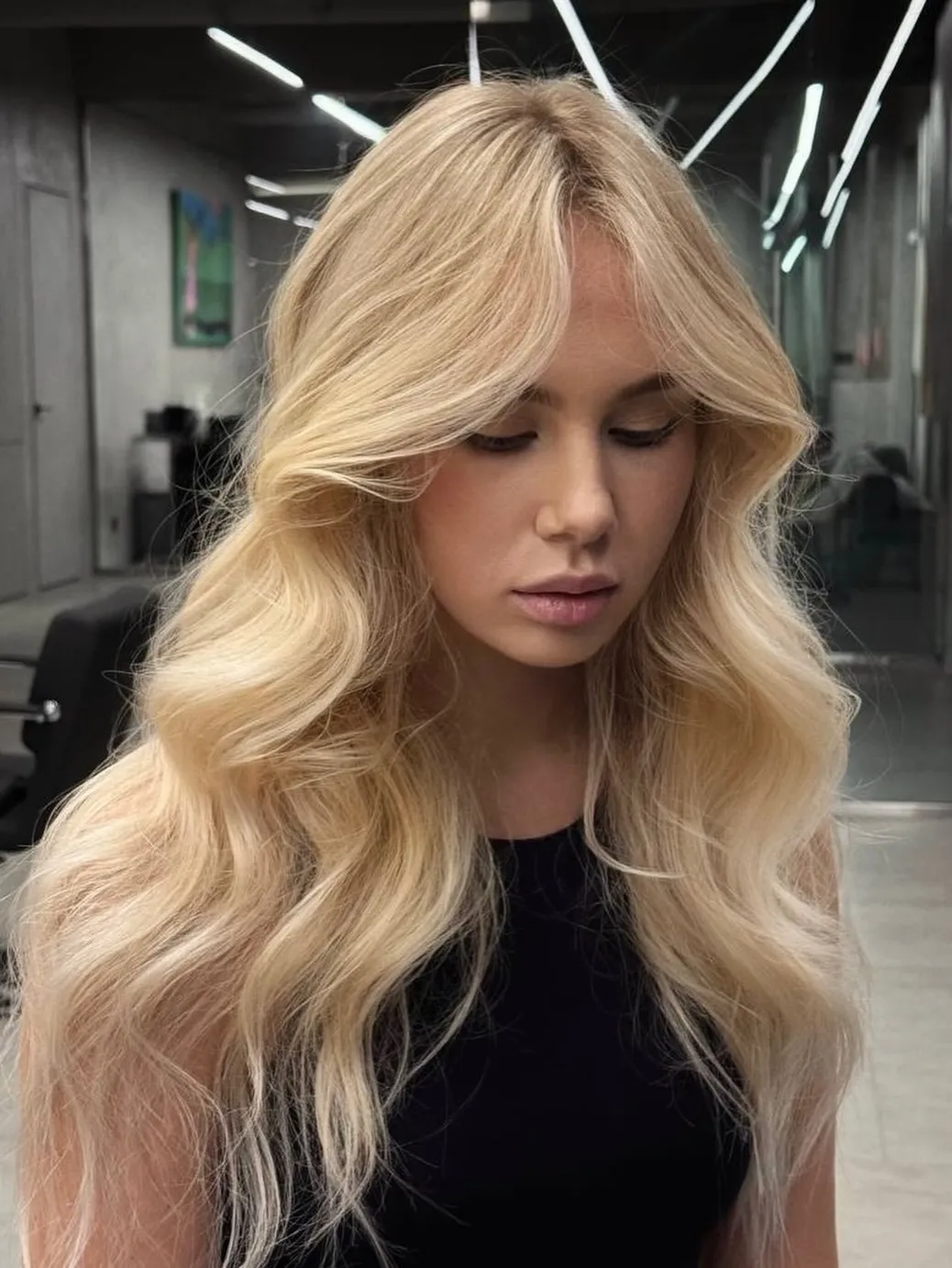 Long baby blonde hair with polished waves
