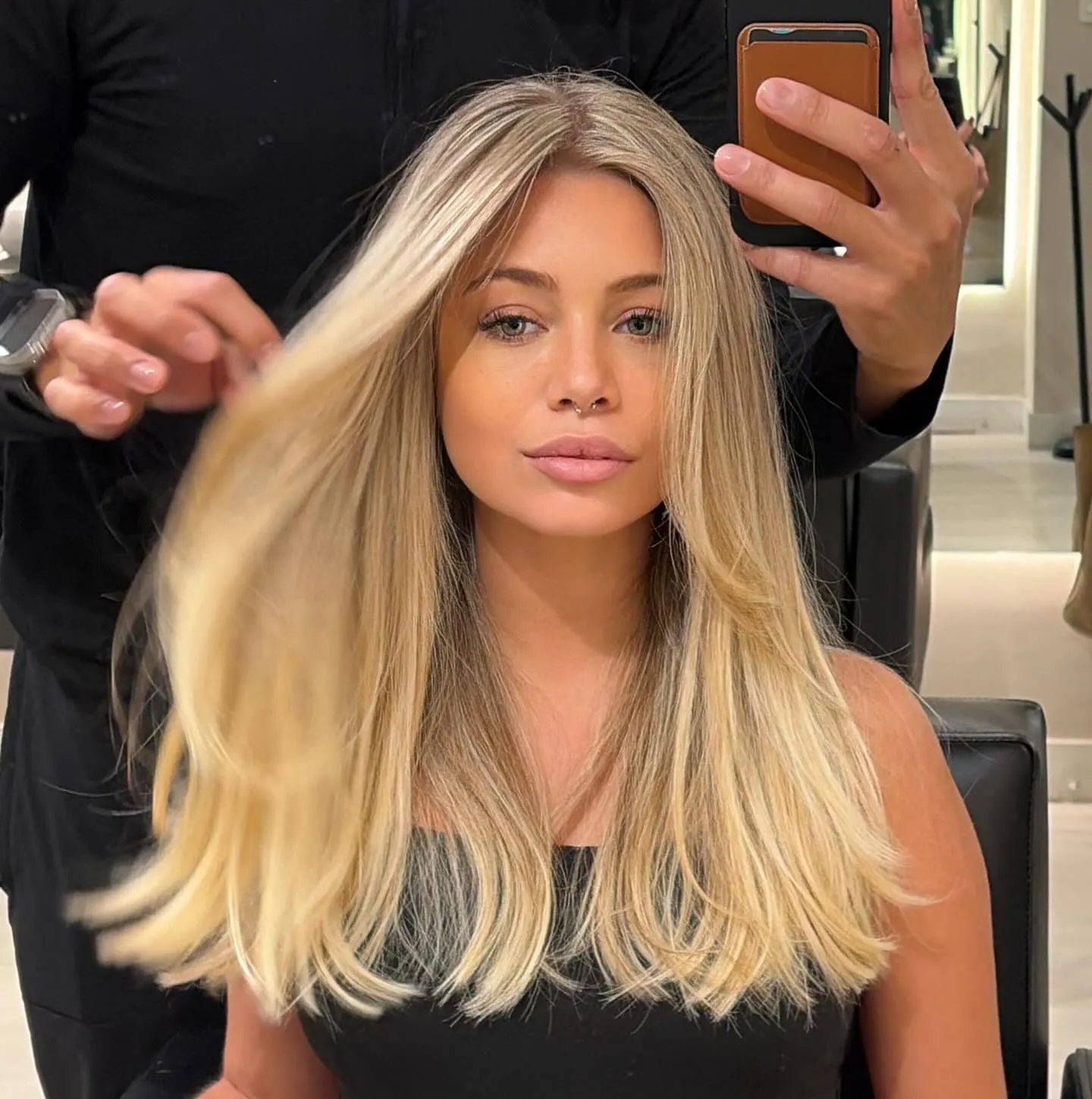 Straight baby blonde hair with face-framing layers