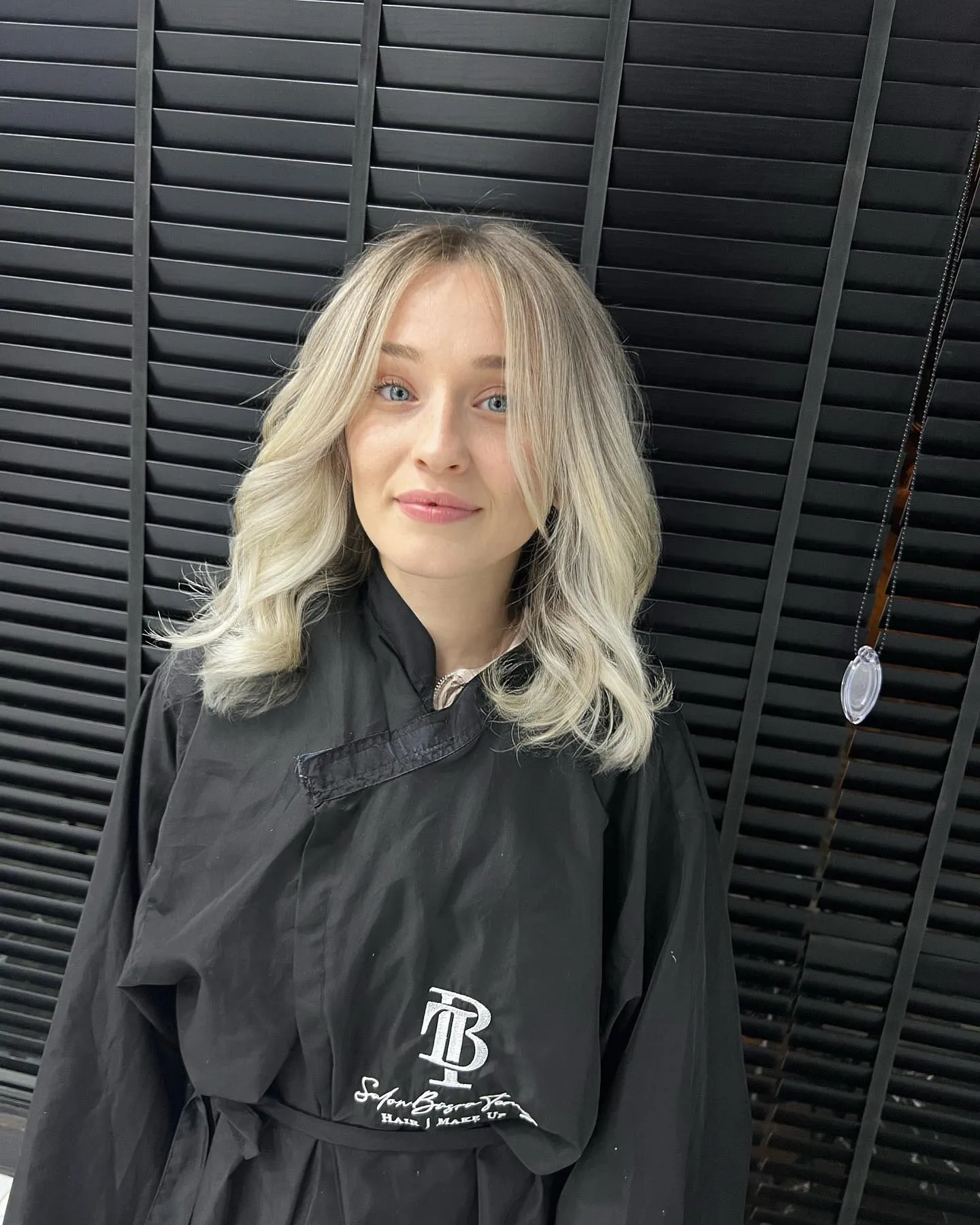 Wavy baby blonde lob with curtain layers