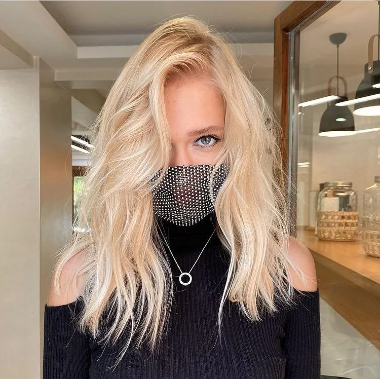 Tousled baby blonde lob with root lift