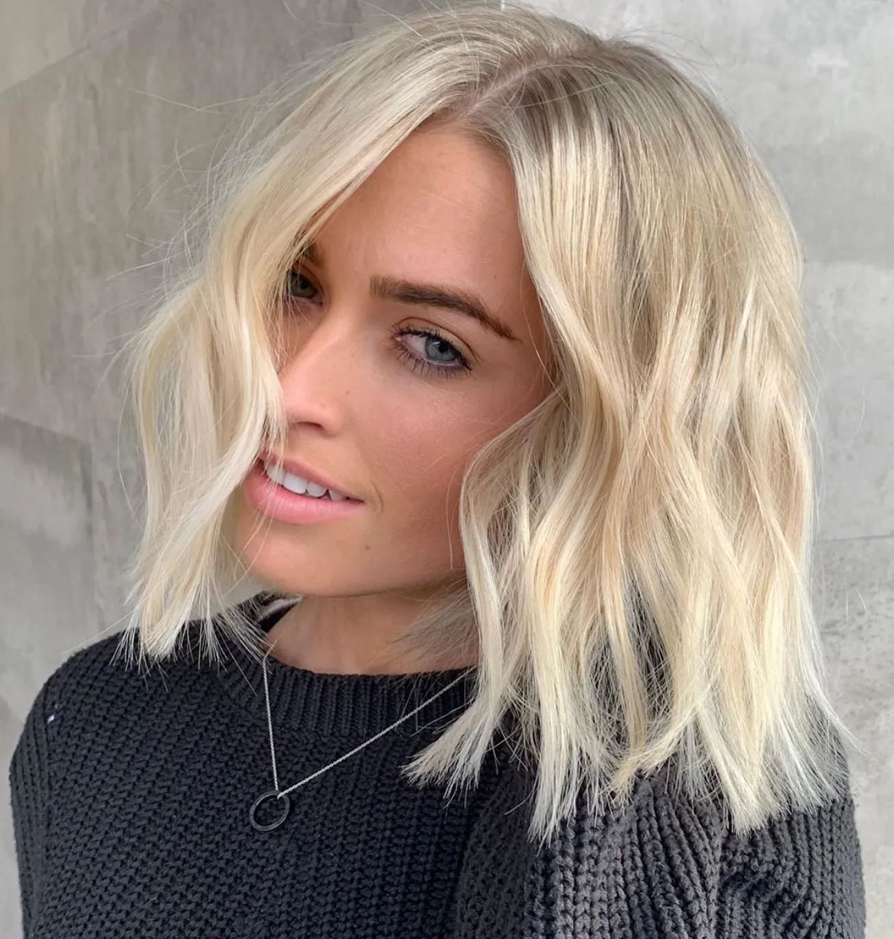 Textured baby blonde lob with deep side part