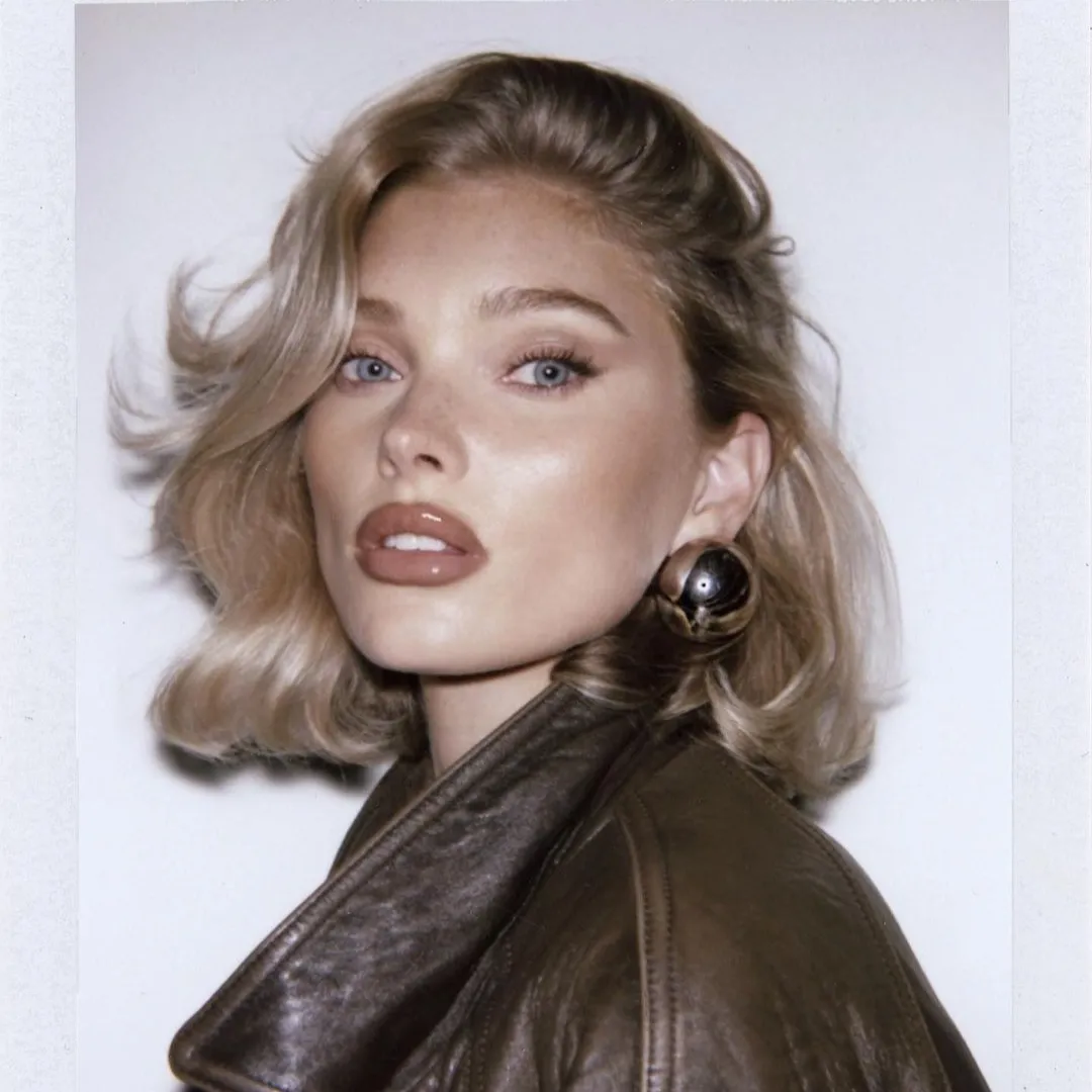 Blonde brushed-back bob with rounded ends and tucked side