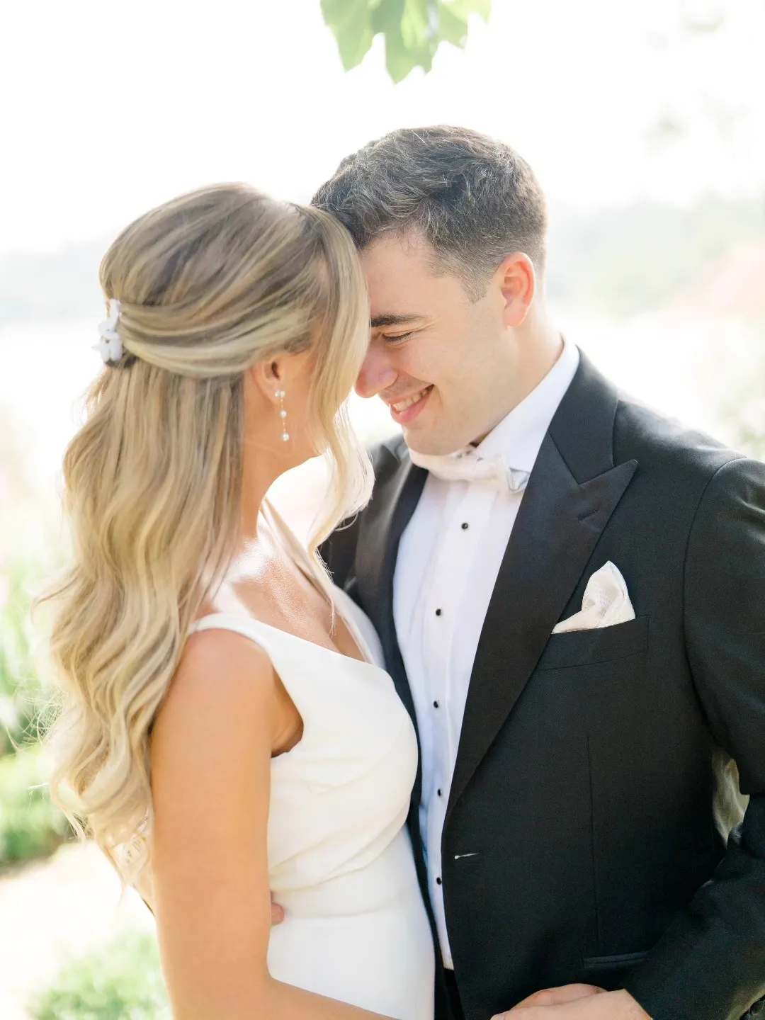 Soft blonde half-up wedding hairstyle with long loose waves