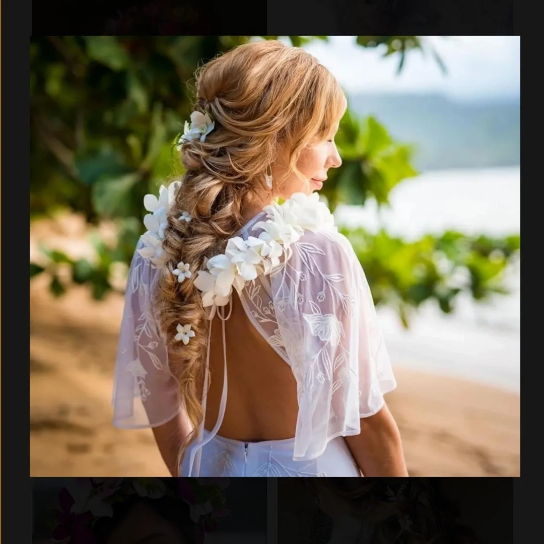 Loose blonde braid with white flowers woven through the hair