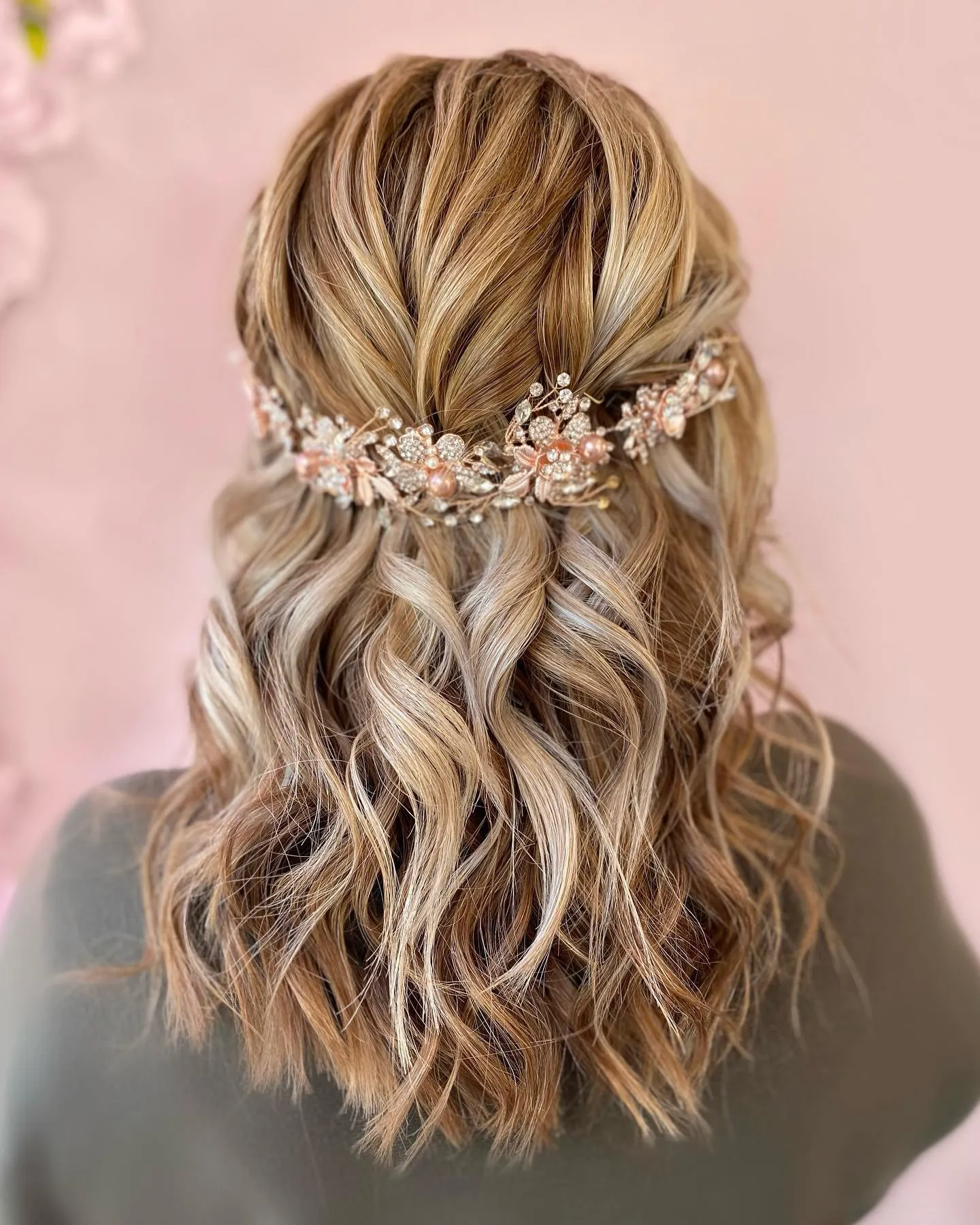 Half-up blonde waves with a jeweled bridal hair vine