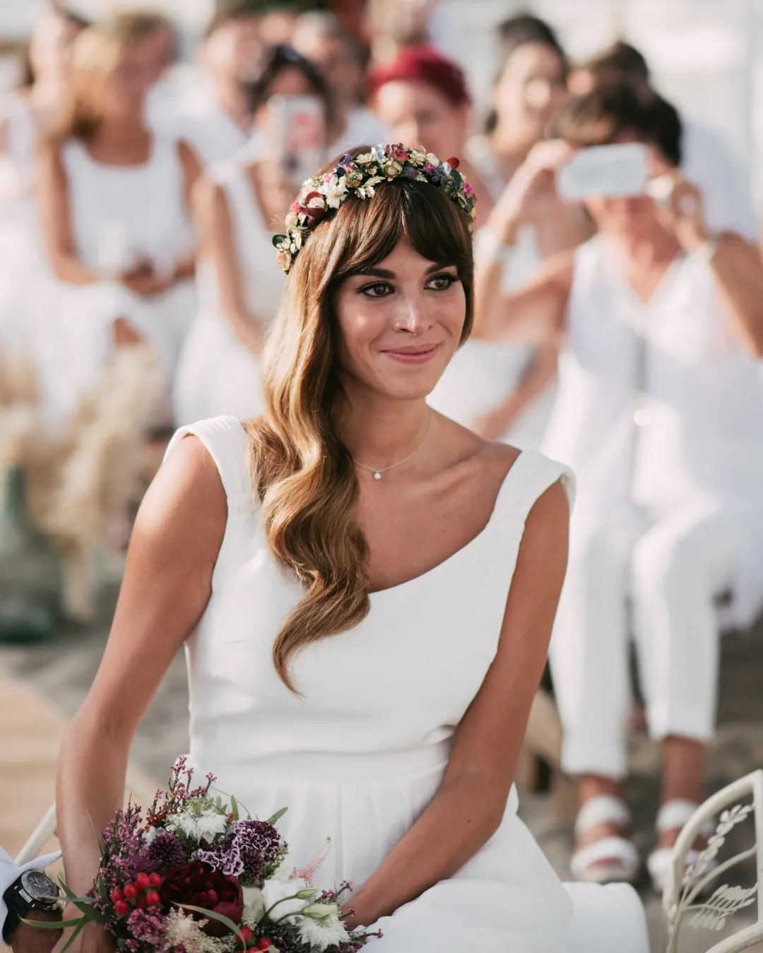 Long side-swept waves with a colourful floral crown and soft fringe