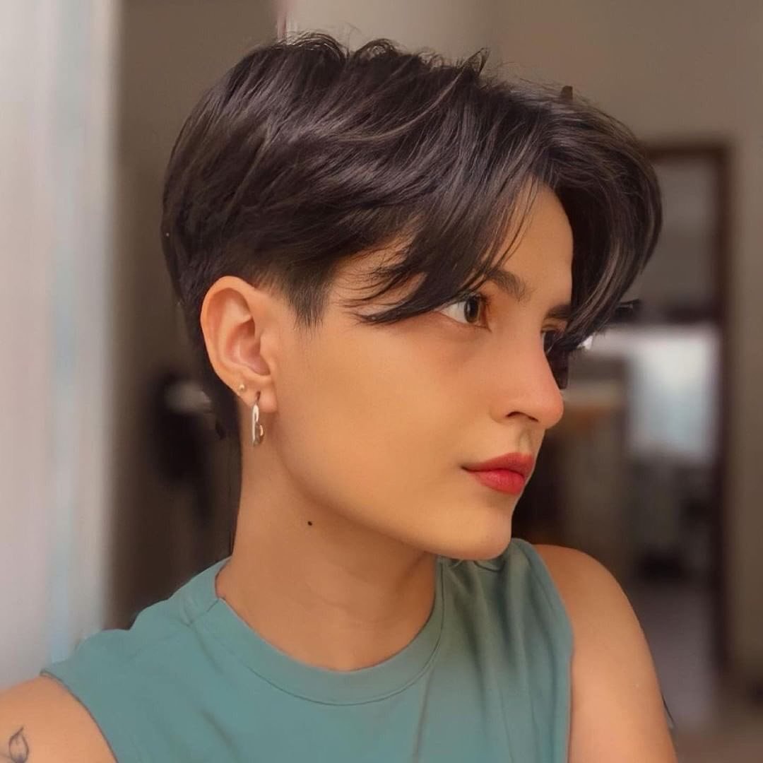 Sleek dark bixie with centre-parted long fringe and short sides