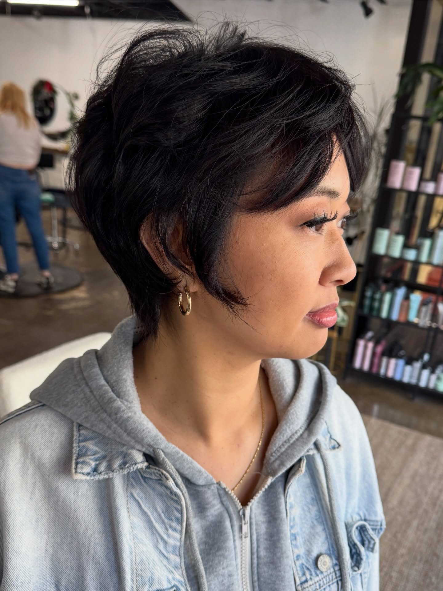 Textured dark bixie with a swept crown and short tapered sides