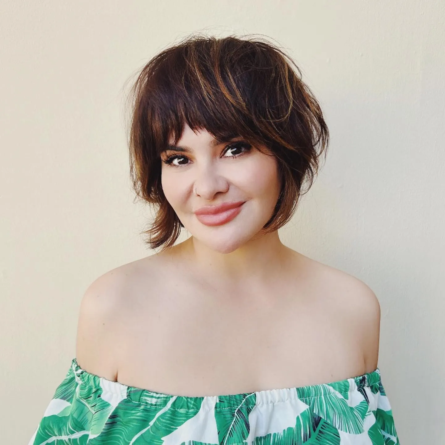 Feathered brunette bixie with wispy fringe and flipped ends