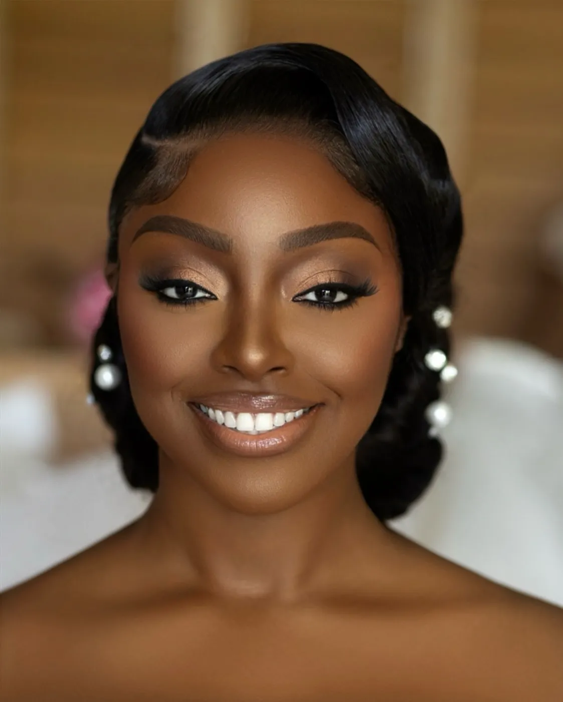 Sculpted bridal side waves with smooth edges and low rolled ends