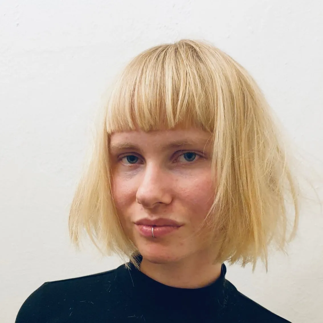 Textured blonde bob with short micro fringe