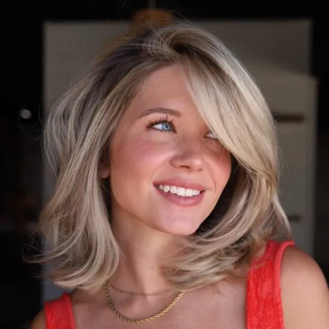 Feathered blonde bob with face-framing layers