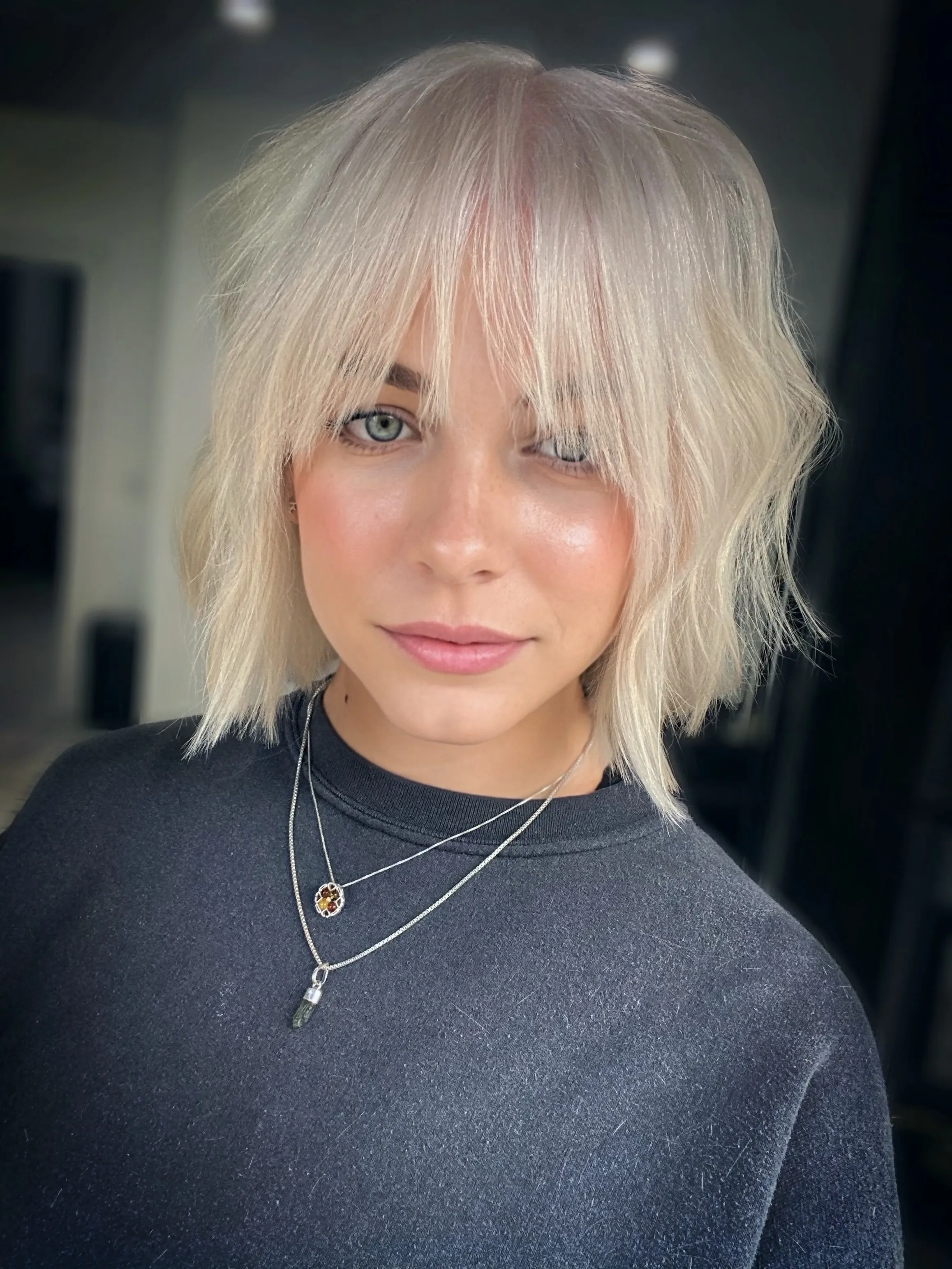 Shaggy blonde bob with long wispy fringe
