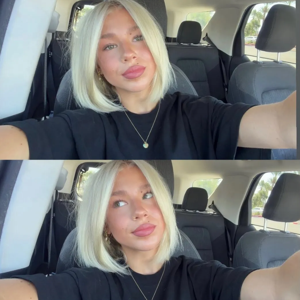 Sleek blunt blonde bob with center part