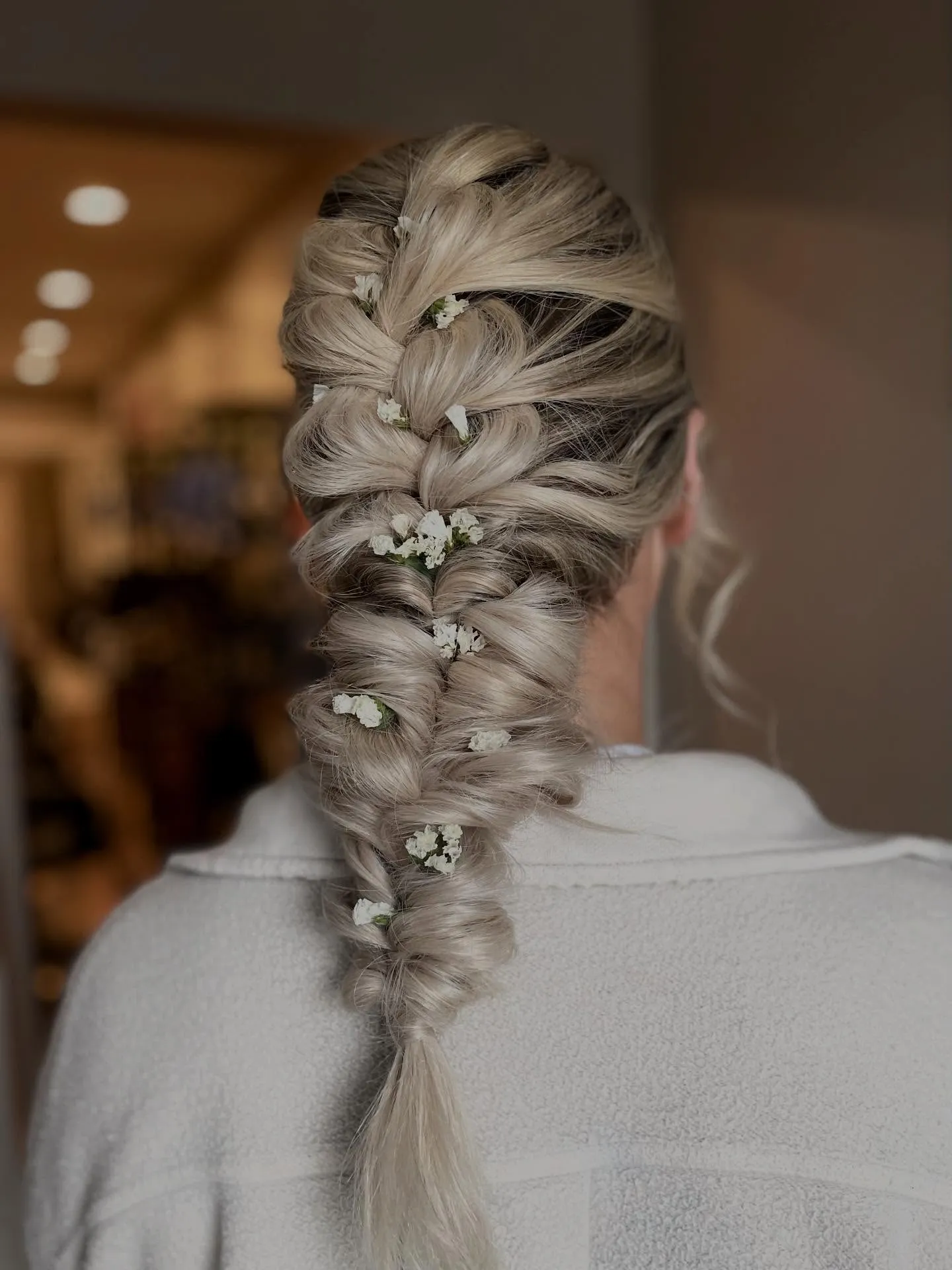 Boho bridal pull-through braid with small white flowers