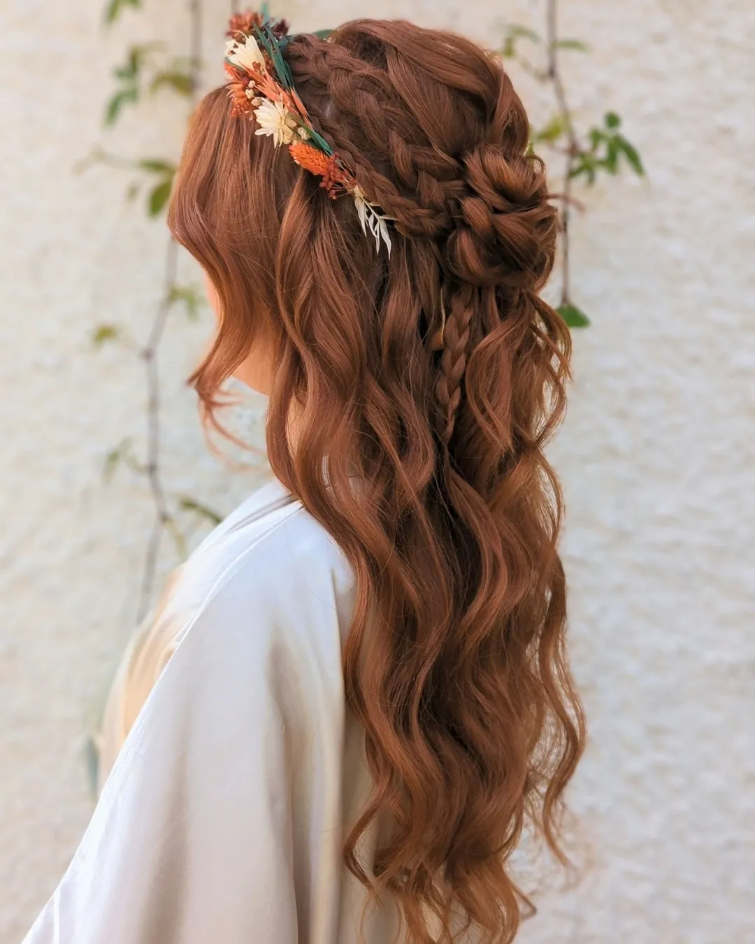 Braided half-up boho bridal waves with autumn flowers