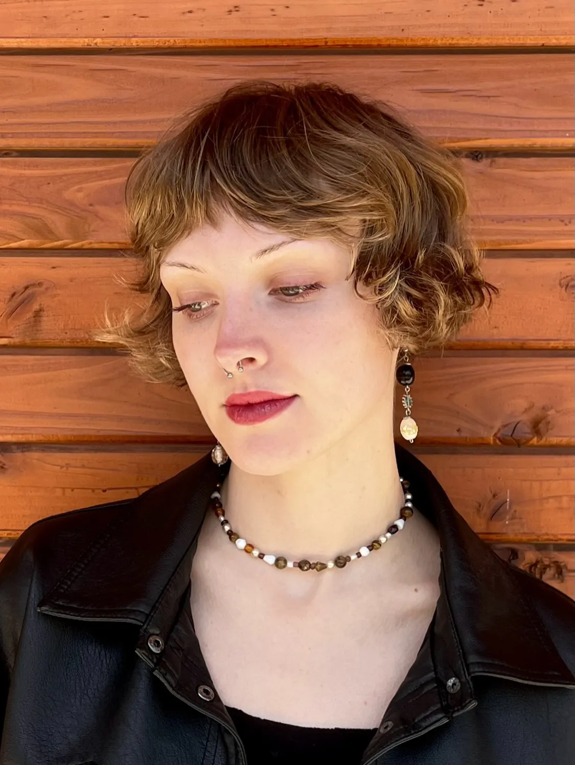 Tousled curly micro bob with short wispy fringe and soft face-framing pieces