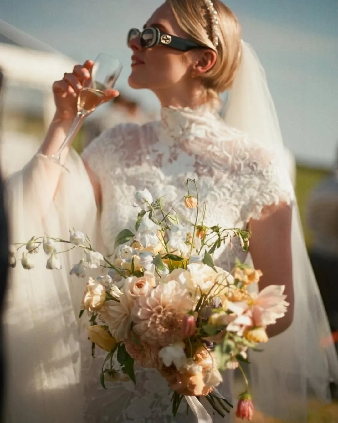 Sleek bridal bob with pearl headband and veil