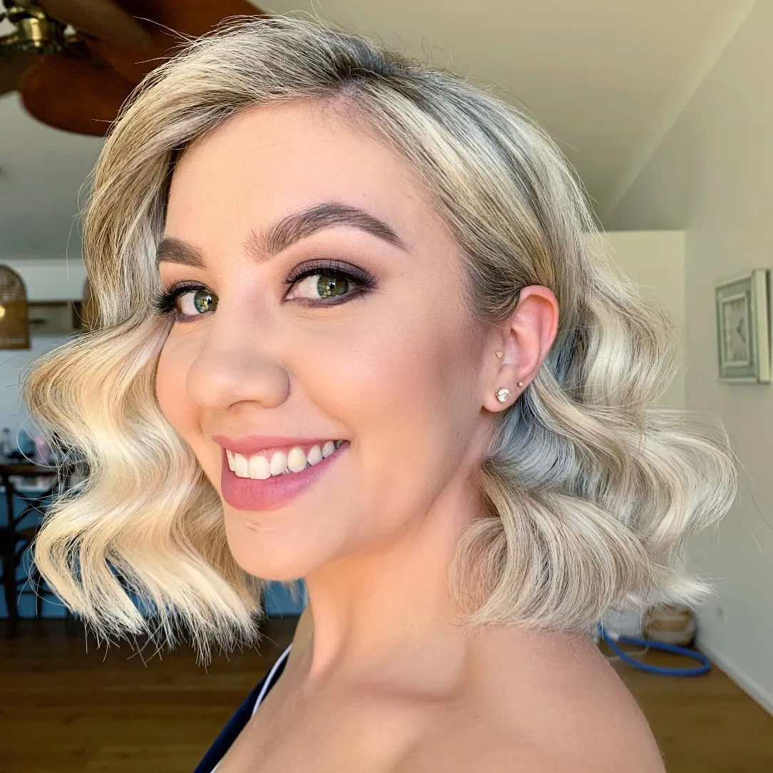 Soft vintage bridal bob with deep side part and brushed waves