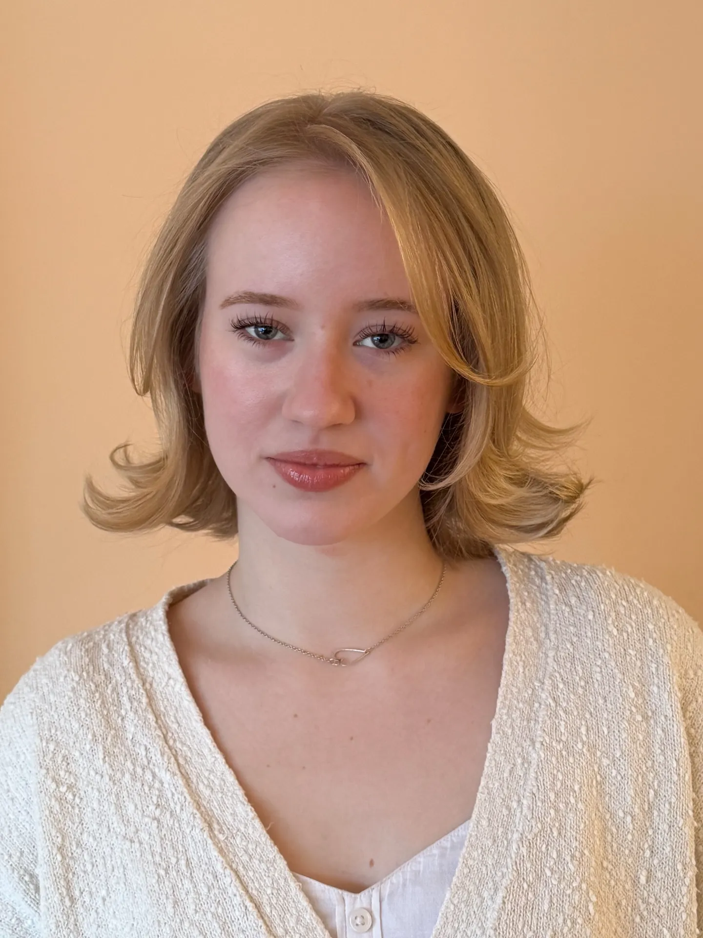 Flipped bridal bob with curtain fringe and outward-curved ends