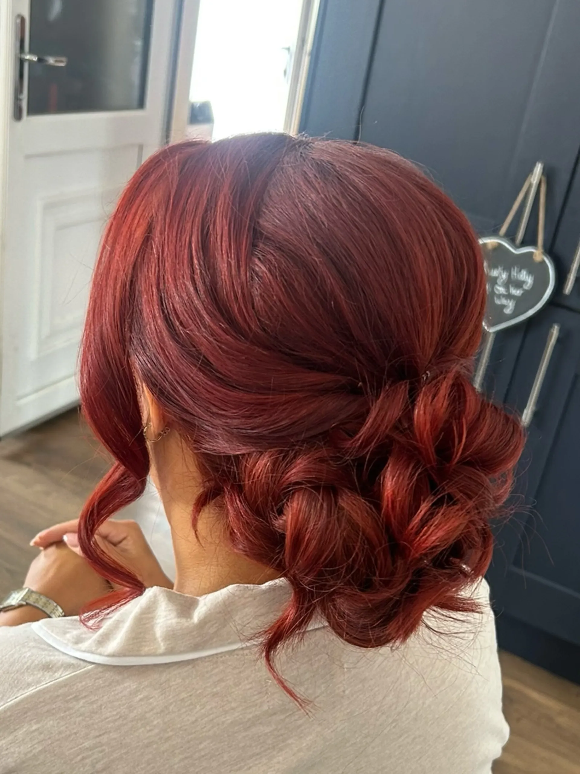 Textured low bun with a smooth rounded crown