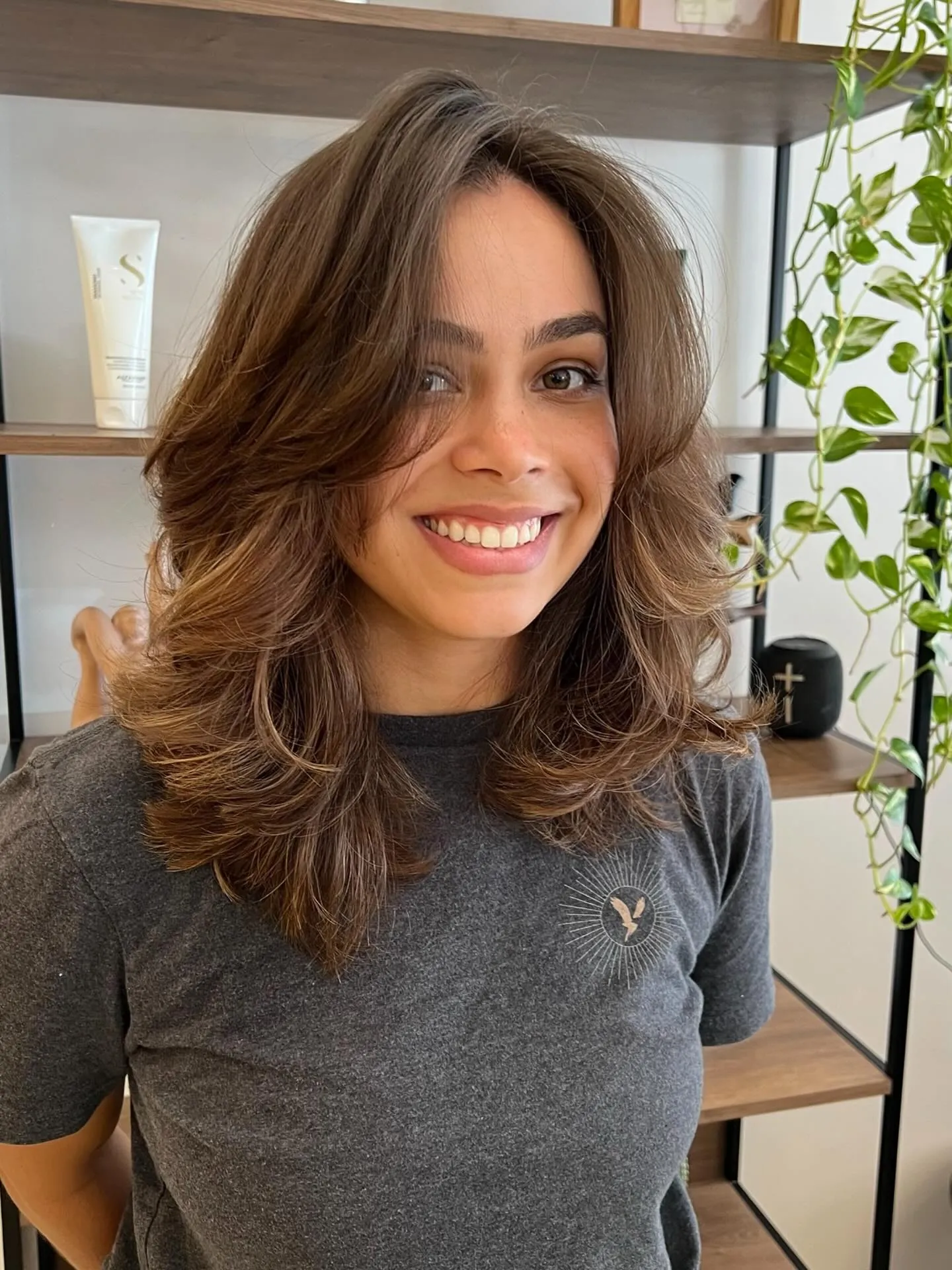 Brunette butterfly lob with smooth outward-flipped layers