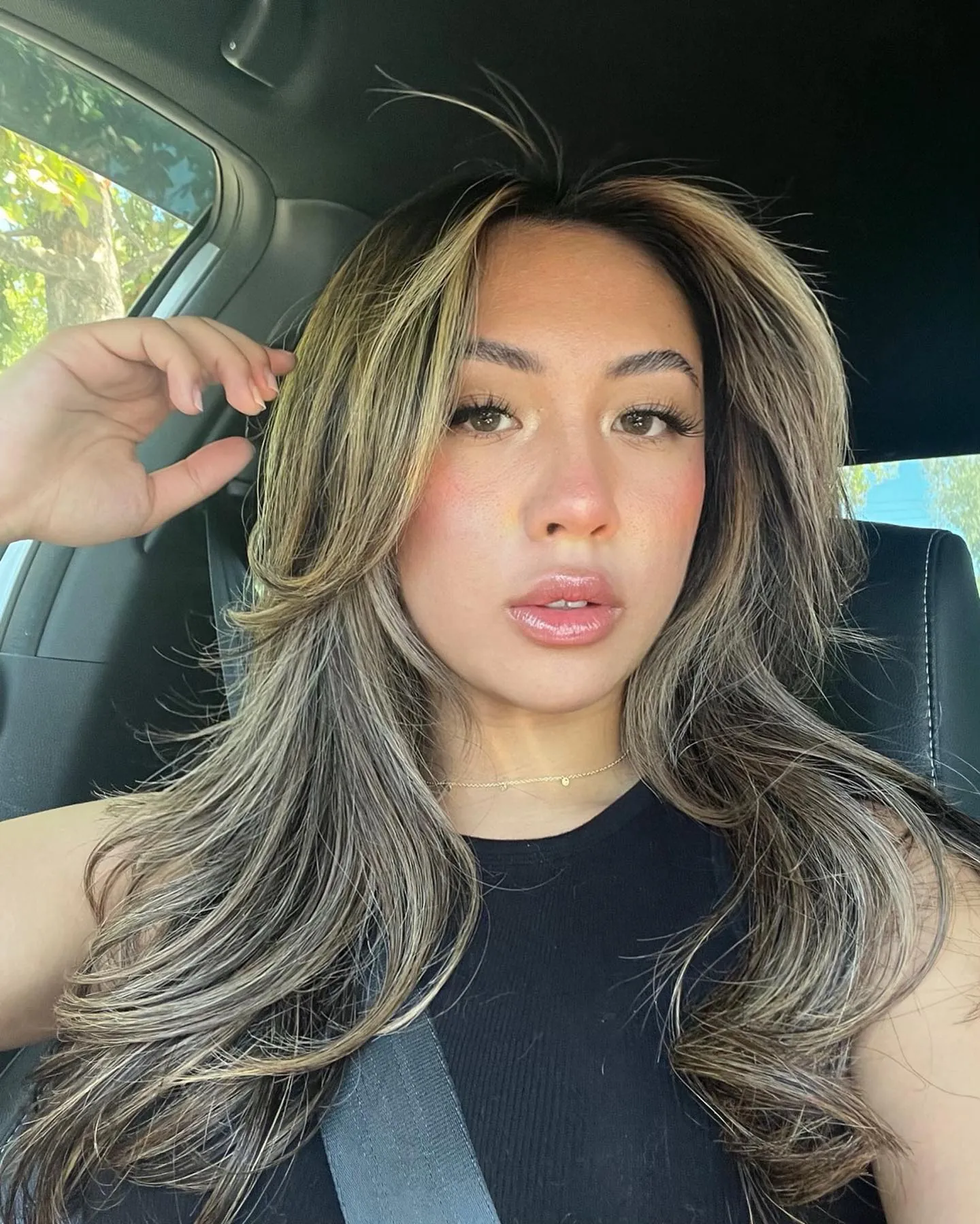 Highlighted long butterfly haircut with feathered curtain layers