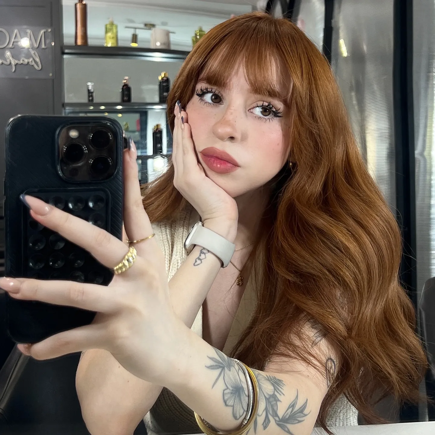 Long copper hair with full fringe and soft layered waves