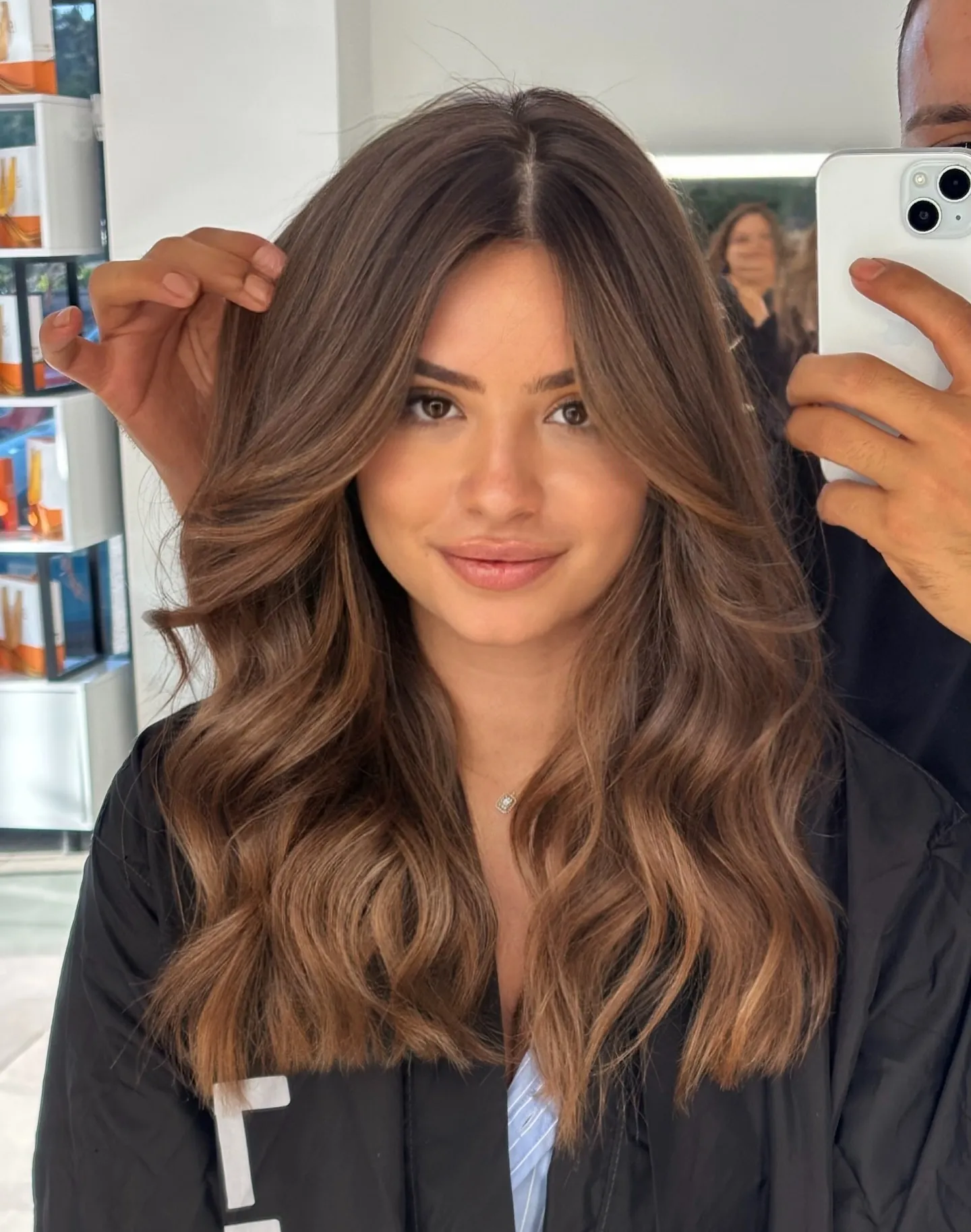 Soft brunette colour melt with loose center-parted waves
