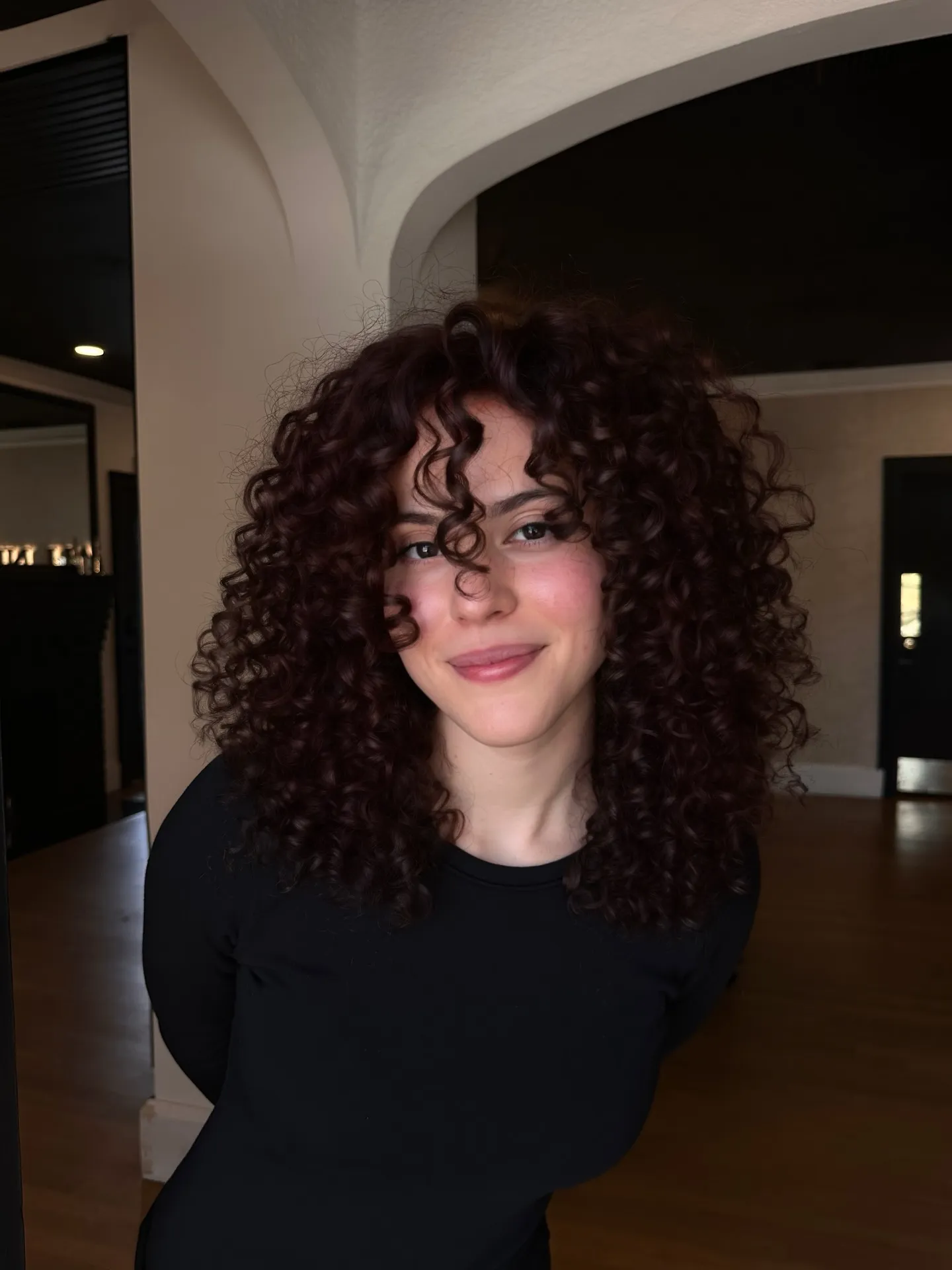 Tight curly shag in a deep burgundy red tone