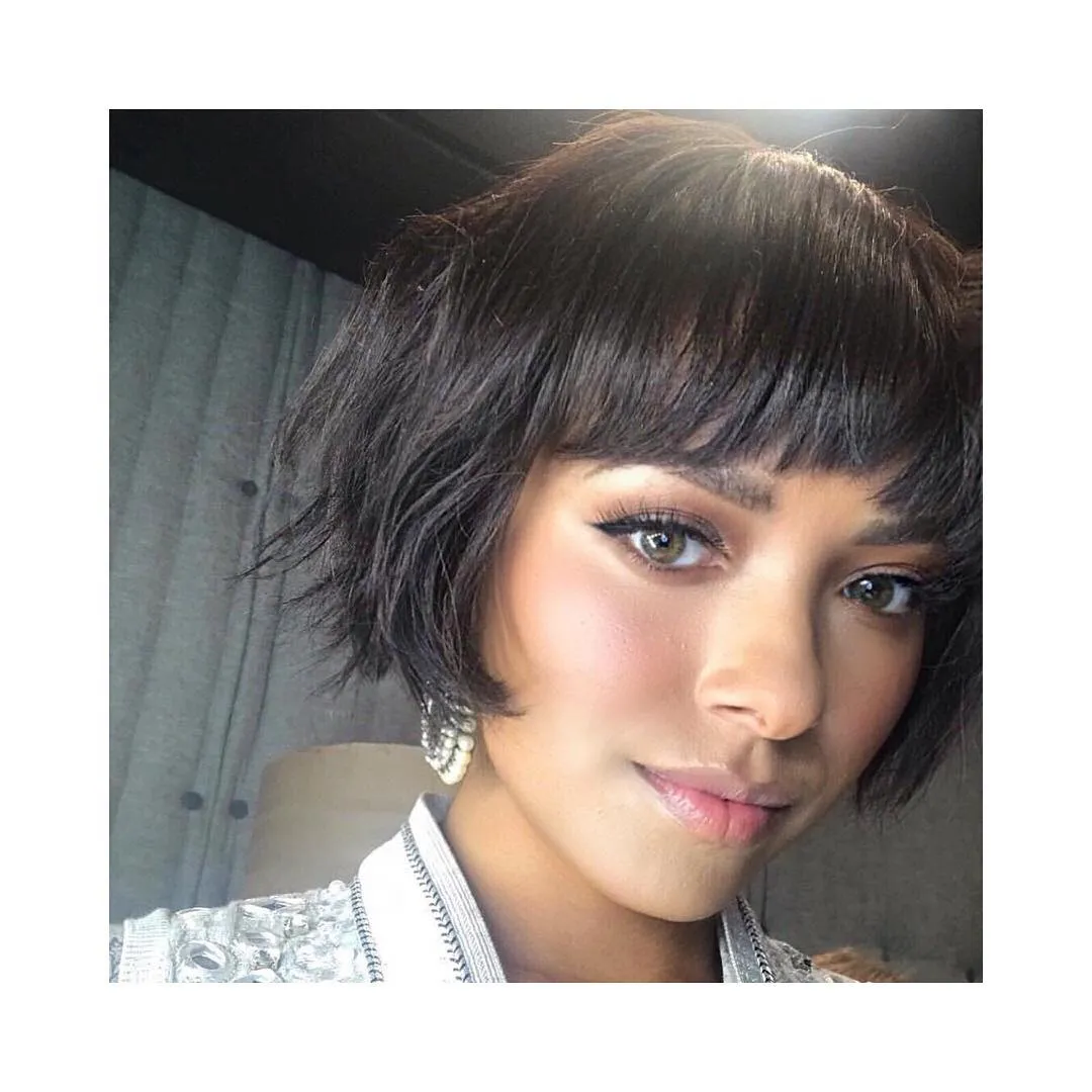 Tousled dark chin-length bob with a short straight fringe