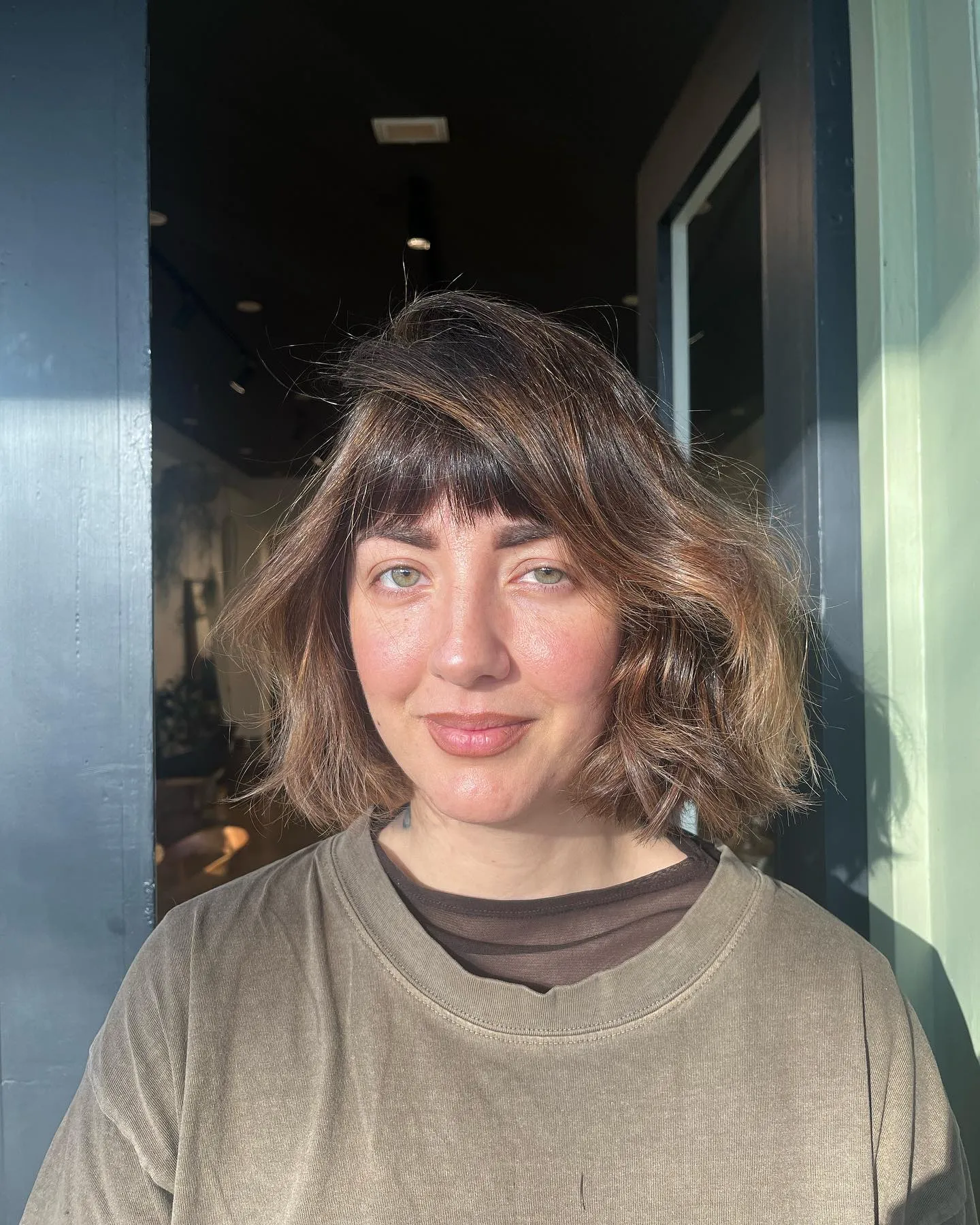 Wavy brown shag bob with a wispy fringe and layered ends
