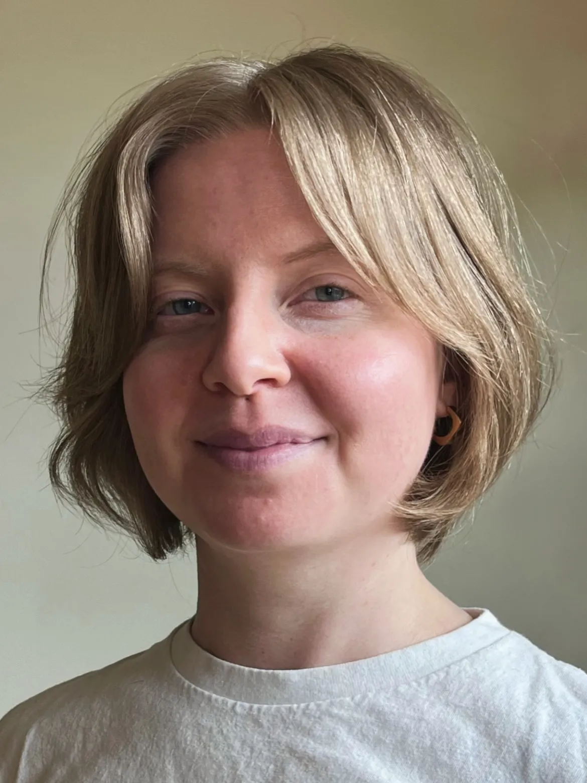 Soft light chin-length bob with a centre part and curved ends