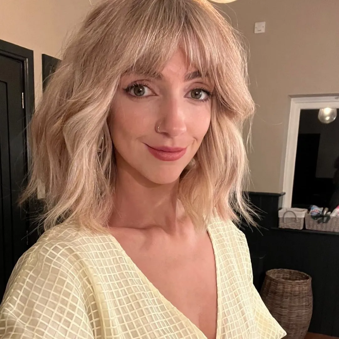 Layered choppy bob with airy curtain bangs