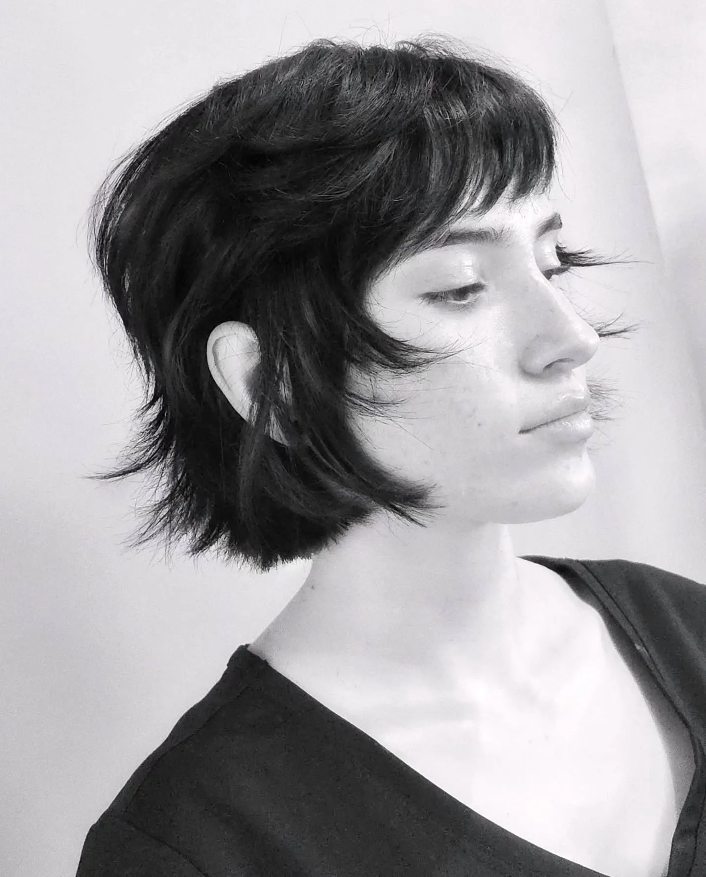 Shaggy choppy bob with short fringe and flipped layers