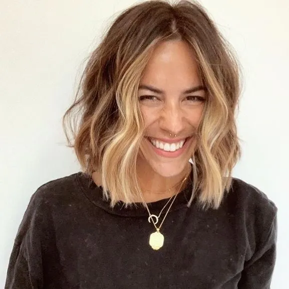 Centre-parted wavy bob with blunt textured ends