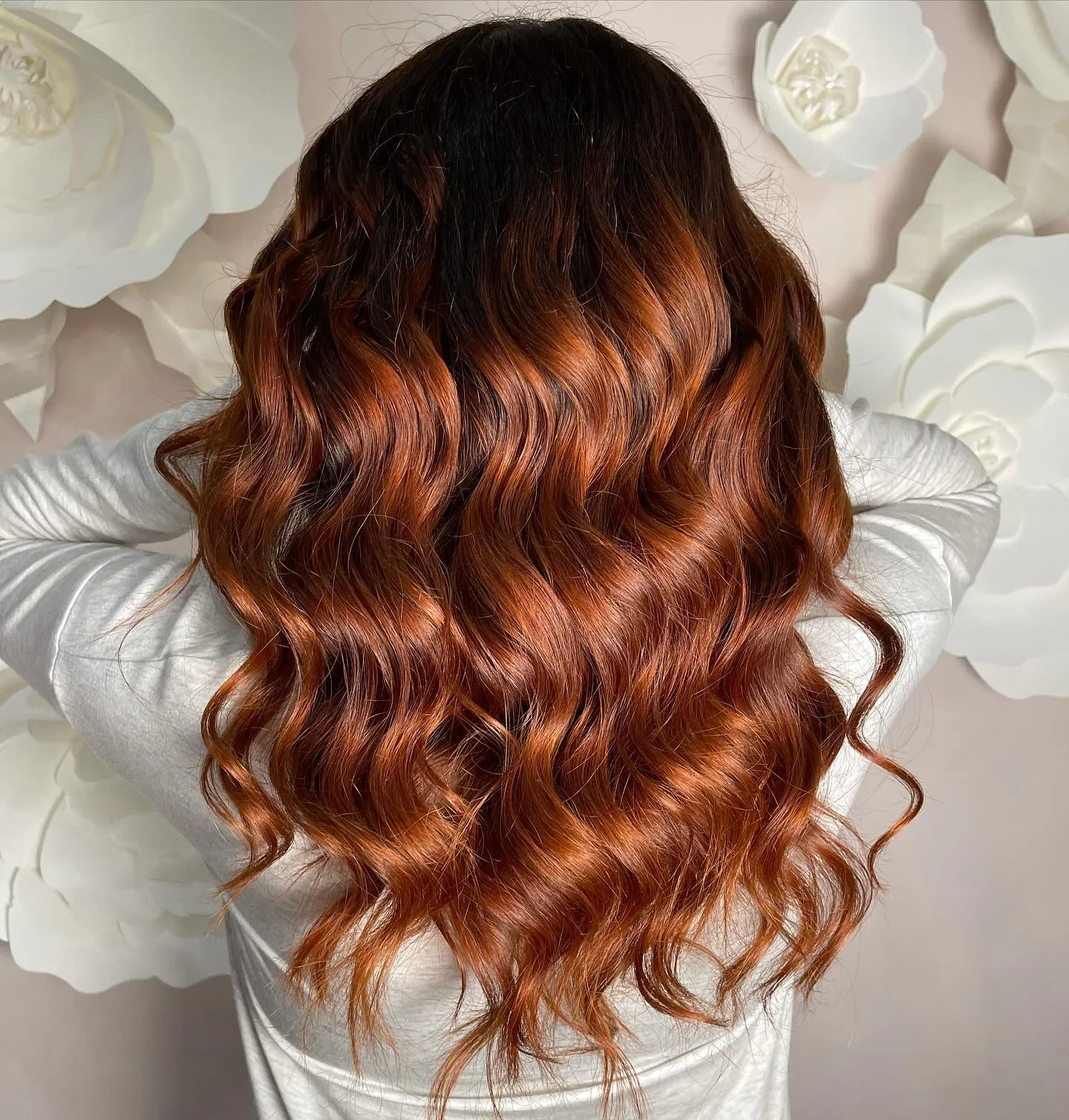 Rooted copper balayage with rich glossy waves