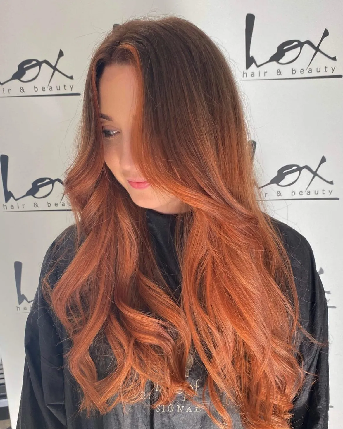 Long brown-to-copper balayage with cascading waves