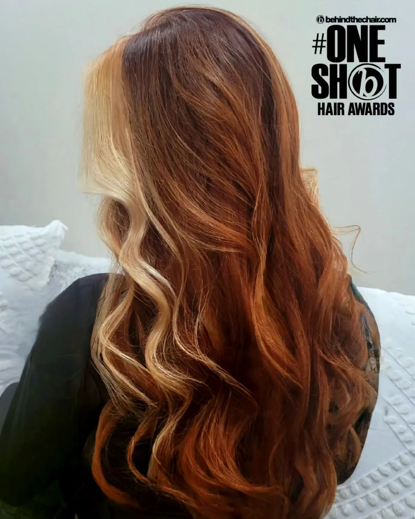 Long copper hair with a light face-framing streak and loose waves