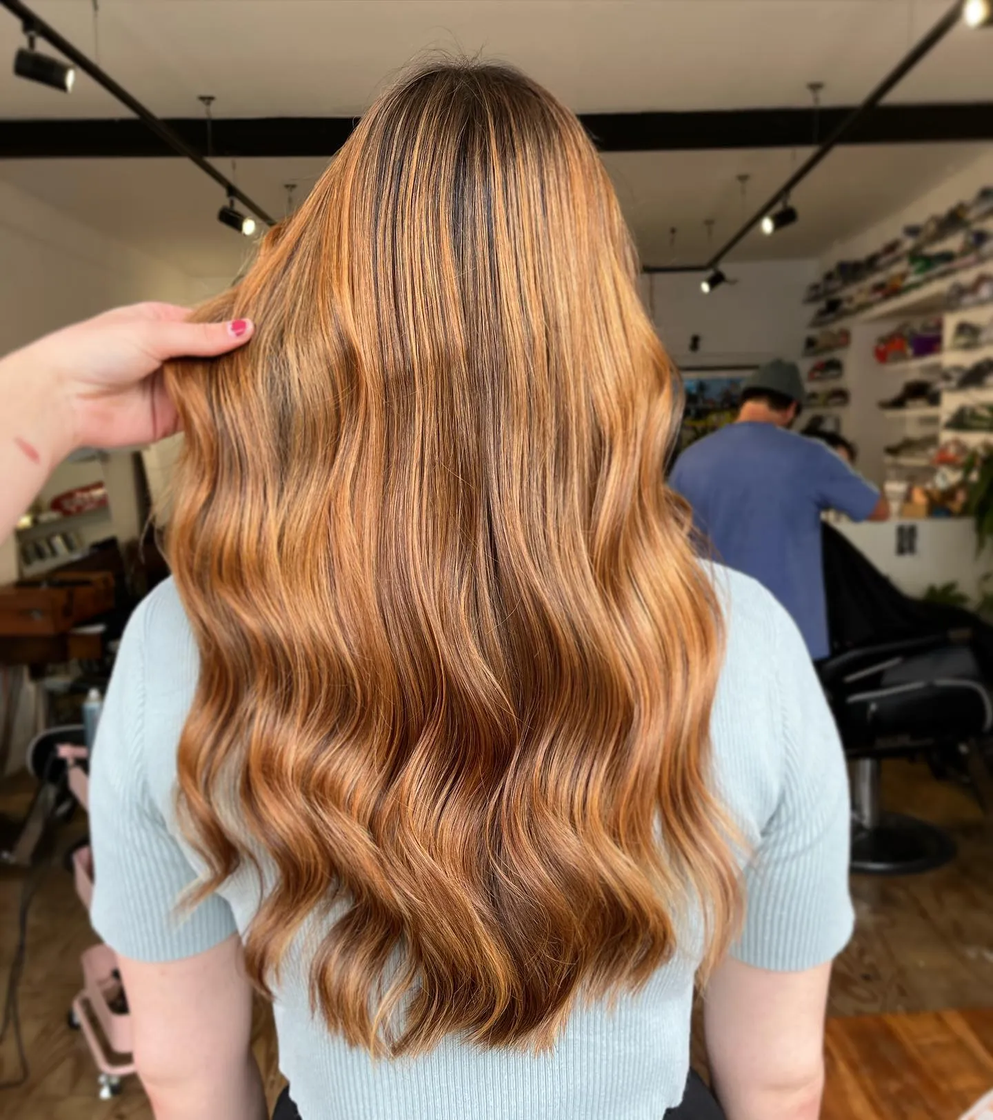 Long polished waves with bright copper balayage